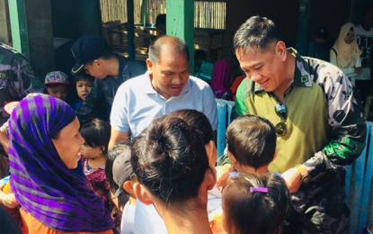 <p>Chief Supt. Billy Beltran, Police Regional Office-9 (PRO-9) director, leads the distribution of school supplies to the Islamic School (Madrasa) in Sirawai, Zamboanga del Norte during his visit to the province from March 20 to 21. <em><strong>(Photo courtesy of PRO-9 PIO)</strong></em></p>
